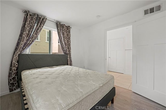 bedroom featuring hardwood / wood-style floors