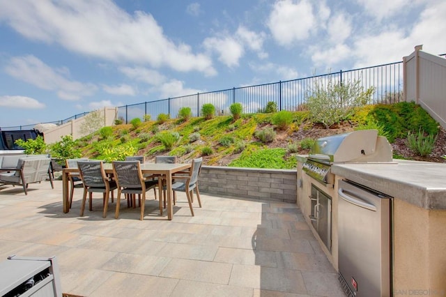 view of patio with grilling area and exterior kitchen