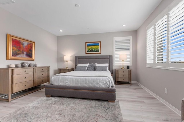 bedroom with light hardwood / wood-style floors