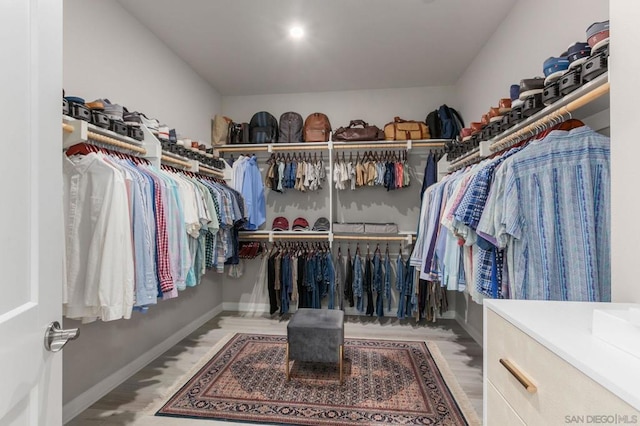 spacious closet with light hardwood / wood-style floors