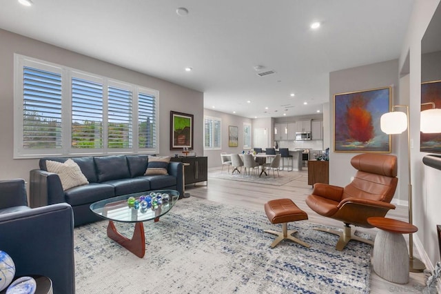 living room with light hardwood / wood-style floors