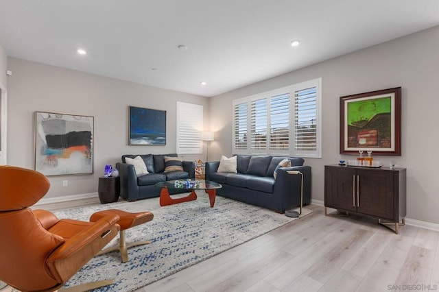 living room with light hardwood / wood-style flooring