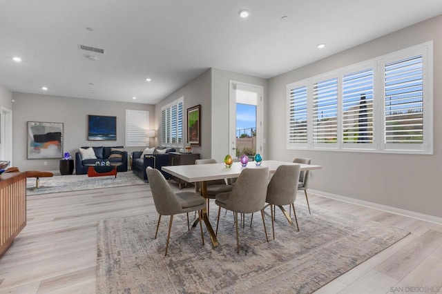 dining space featuring light hardwood / wood-style floors