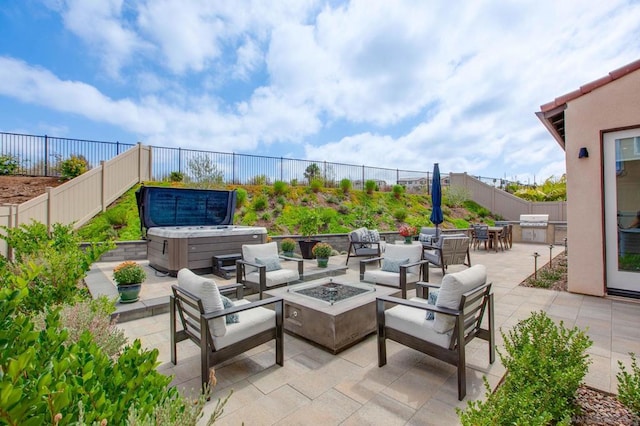 view of patio featuring a grill, a hot tub, and an outdoor living space with a fire pit