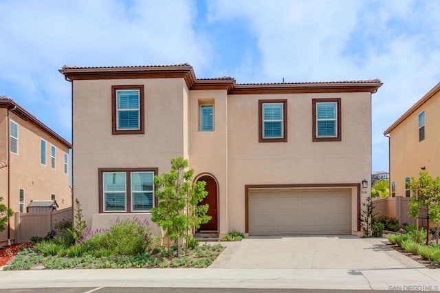 mediterranean / spanish-style house with a garage