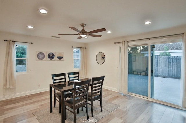 dining area featuring ceiling fan and light wood-type flooring