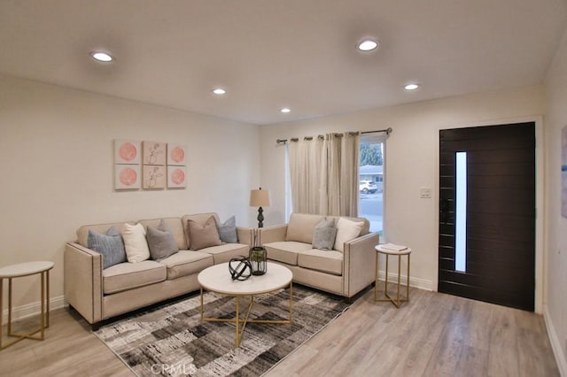 living room with light hardwood / wood-style flooring