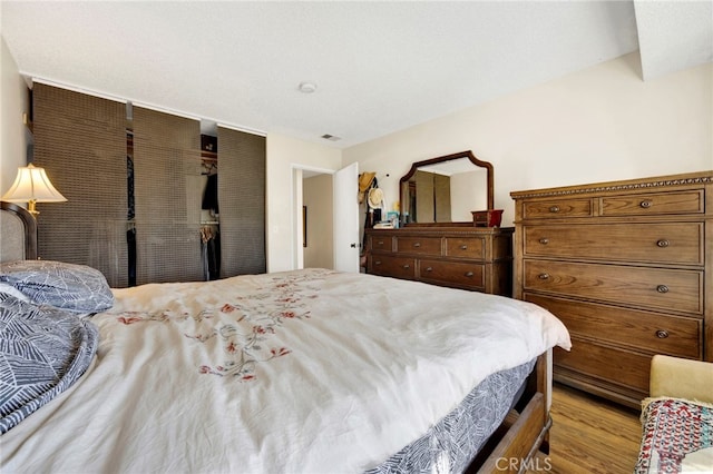 bedroom with light wood-type flooring