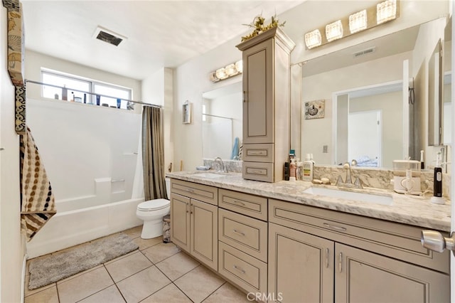 full bathroom featuring tile patterned flooring, shower / bath combination with curtain, vanity, and toilet