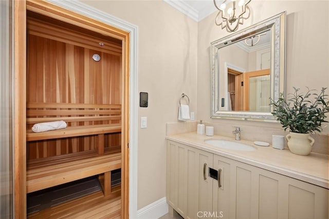 bathroom featuring wood-type flooring, vanity, ornamental molding, and a notable chandelier