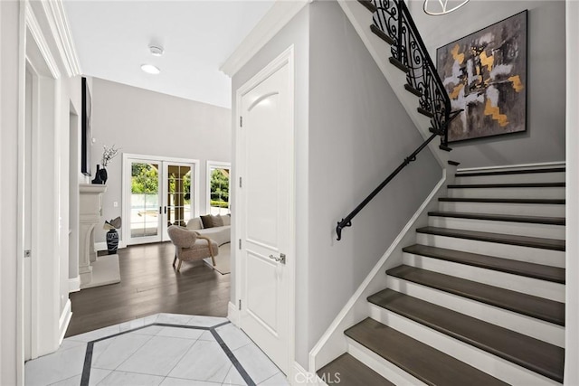 foyer featuring french doors and light hardwood / wood-style floors