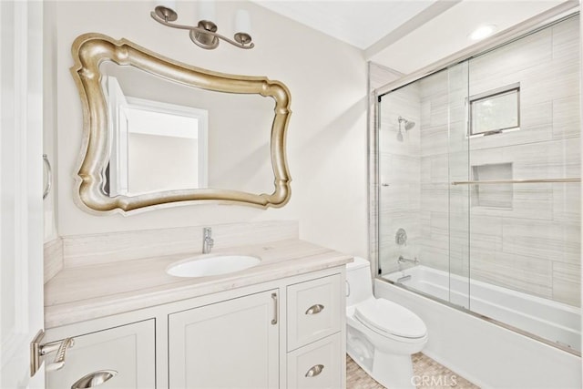 full bathroom with shower / bath combination with glass door, vanity, toilet, and tile patterned flooring