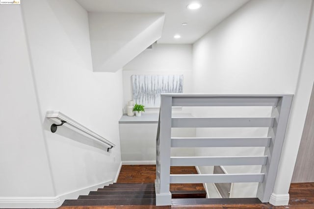 stairs with hardwood / wood-style flooring