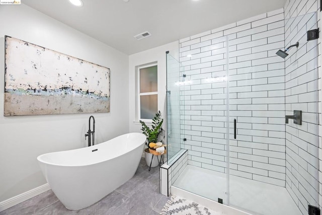 bathroom featuring separate shower and tub