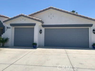 ranch-style home featuring a garage