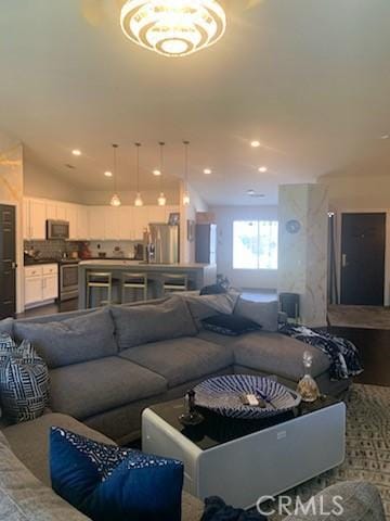 living room featuring lofted ceiling