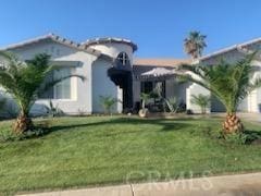 view of front of property with a front lawn