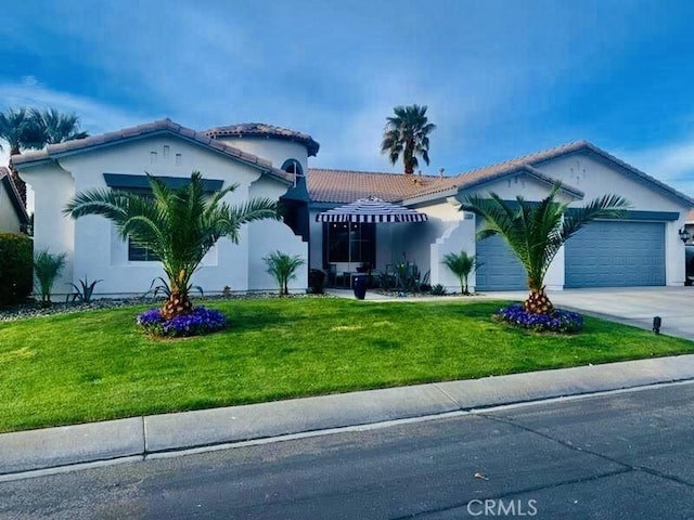 view of front facade featuring a front yard and a garage