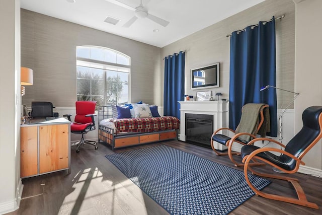 interior space with dark hardwood / wood-style flooring and ceiling fan