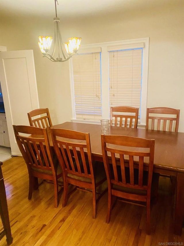 dining room featuring a chandelier and hardwood / wood-style flooring