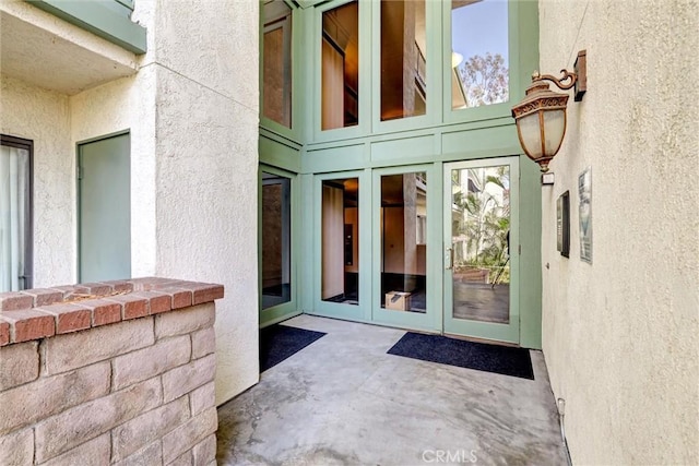 doorway to property featuring a patio and french doors