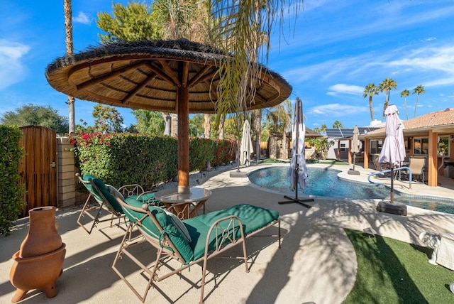 view of swimming pool featuring a patio area