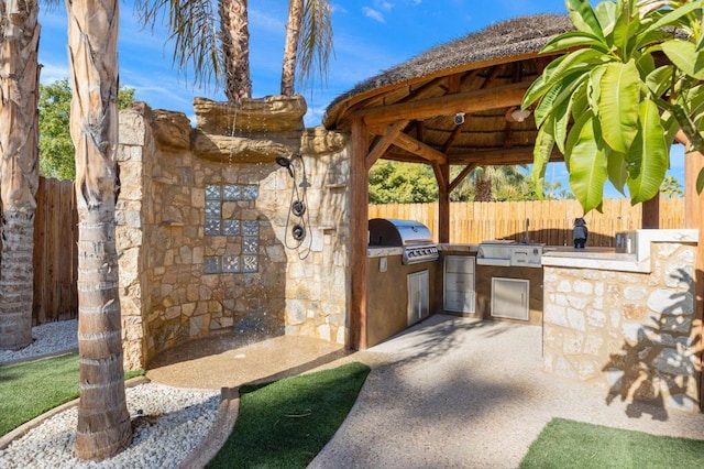 view of patio / terrace with a gazebo, area for grilling, and grilling area