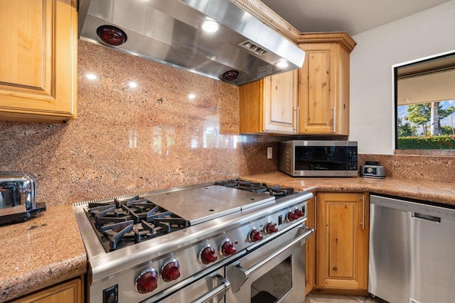 kitchen with exhaust hood, decorative backsplash, and stainless steel appliances