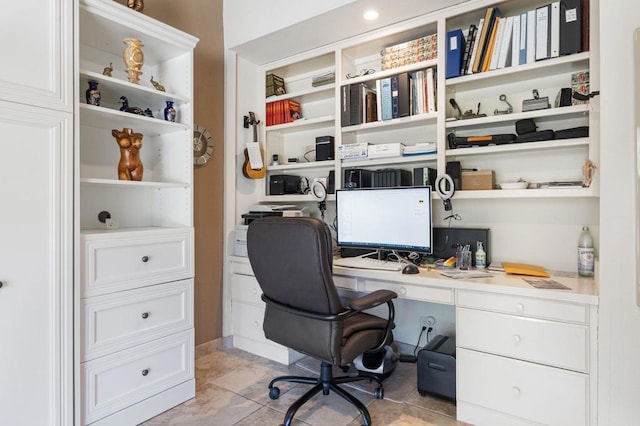 tiled office space featuring built in desk