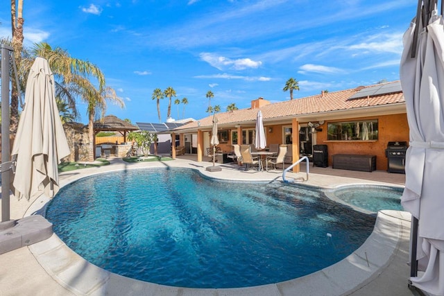 view of swimming pool featuring a patio