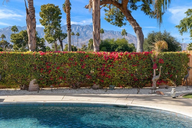 view of swimming pool featuring a mountain view