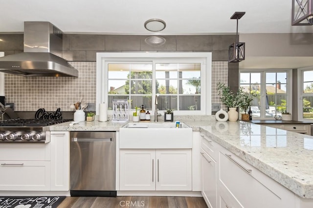 kitchen with dark hardwood / wood-style floors, white cabinetry, a wealth of natural light, and wall chimney exhaust hood