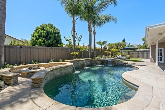 view of pool with pool water feature and a patio