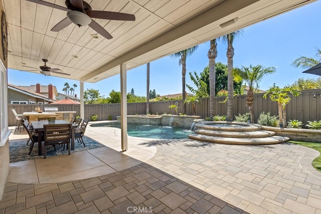 view of swimming pool featuring a patio, pool water feature, a hot tub, and ceiling fan