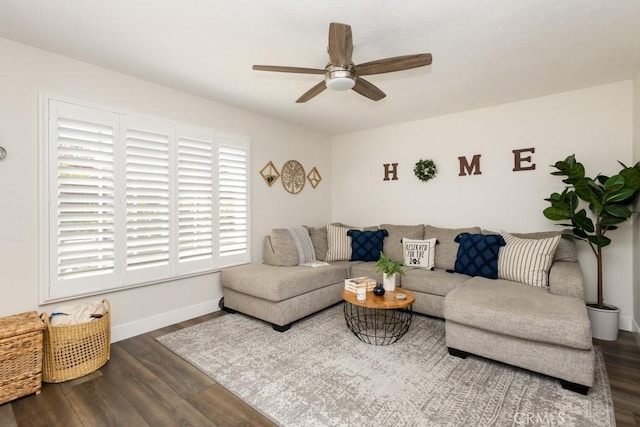 living room featuring ceiling fan and wood-type flooring