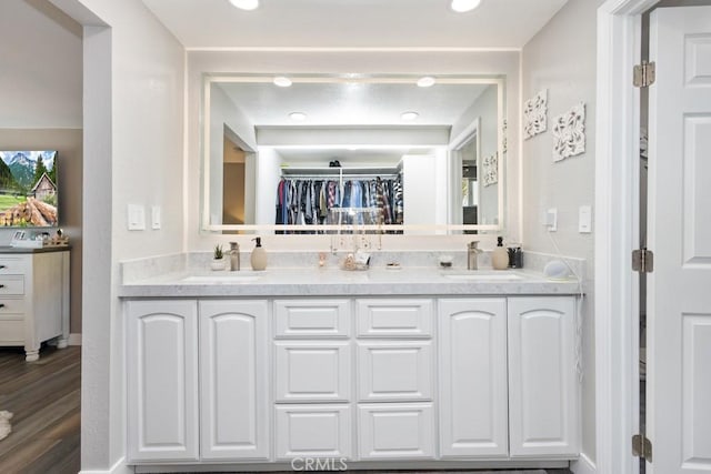 bathroom featuring vanity and wood-type flooring