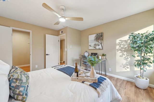 bedroom featuring ceiling fan and light wood-type flooring