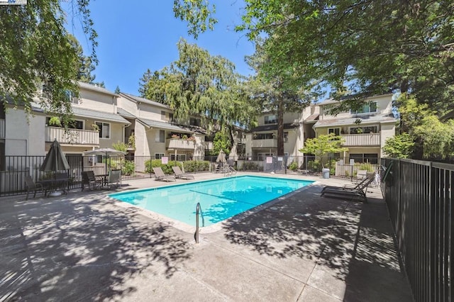 view of swimming pool featuring a patio area