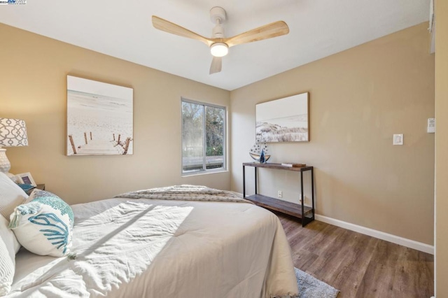 bedroom featuring ceiling fan and hardwood / wood-style floors