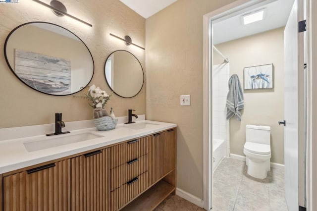 full bathroom featuring tile patterned floors, vanity, toilet, and bathing tub / shower combination