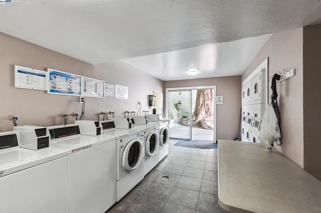 clothes washing area with tile patterned floors, washer and dryer, and stacked washer and clothes dryer