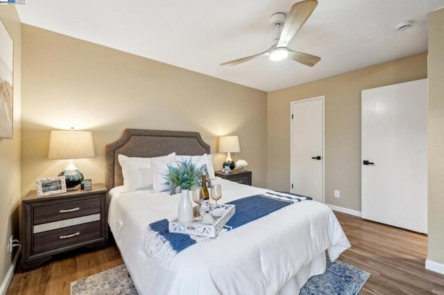 bedroom featuring hardwood / wood-style flooring and ceiling fan