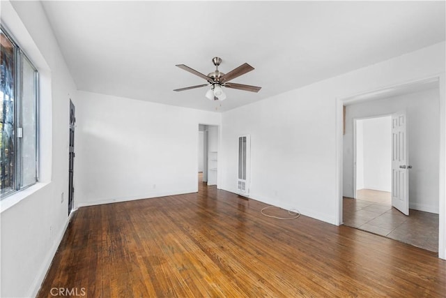 spare room featuring hardwood / wood-style flooring and ceiling fan