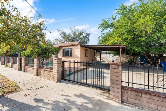 view of gate with a carport