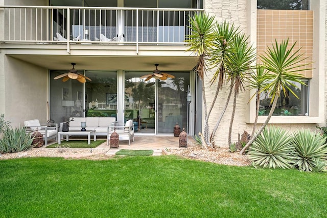 entrance to property featuring an outdoor hangout area, a balcony, a patio, and a lawn