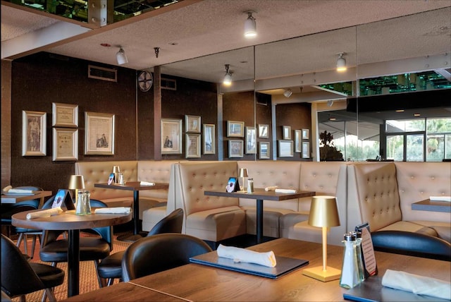 interior space with a textured ceiling and hardwood / wood-style flooring