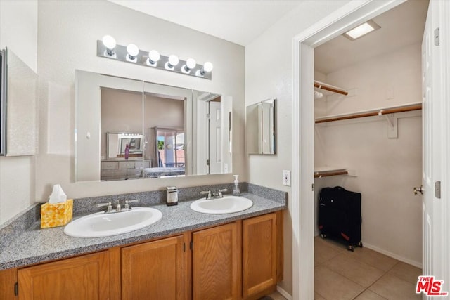 bathroom with tile patterned flooring and vanity