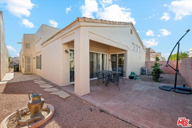 rear view of house featuring a patio area