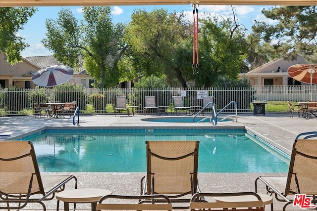 view of pool featuring a patio area