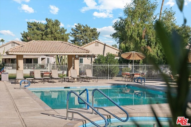 view of swimming pool with a patio